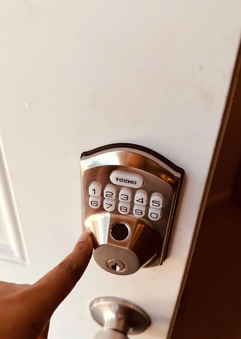 Keyless keypad deadbolt entry lock installed on a resident bedroom door